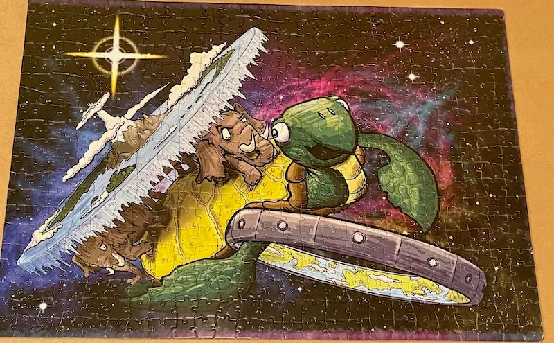 A jigsaw puzzle by Howard Taylor featuring Diskworld and Ringworld
